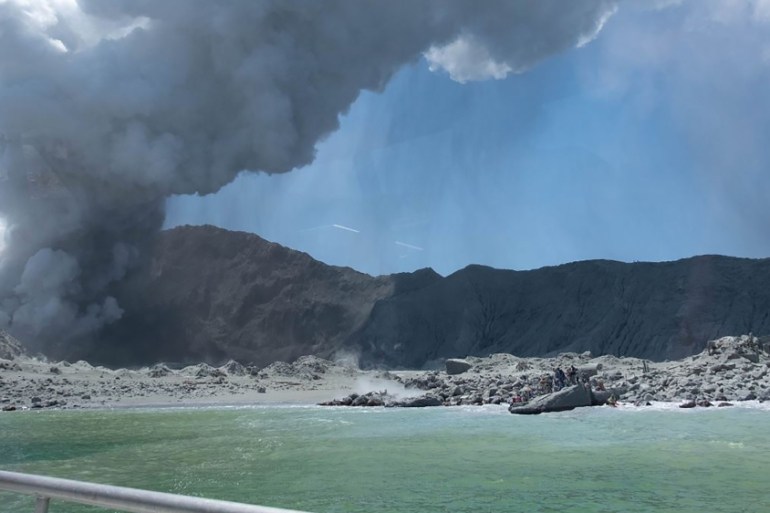 This handout photograph courtesy of Michael Schade shows the volcano on New Zealand''s White Island spewing steam and ash minutes following an eruption on December 9, 2019. New Zealand police said at l