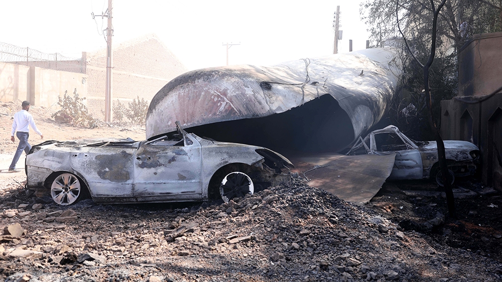 A damaged vehicle is seen at the site of a tile manufacturing unit after an explosion in an industrial zone, north Khartoum, Sudan, 03 December 2019. According to media reports quoting medical sources