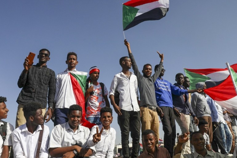 People gather as they celebrate first anniversary of mass protests that led to the ouster of former president and longtime autocrat Omar al-Bashir. in Khartoum, Sudan, Thursday, Nov. 19, 2019. (AP Pho