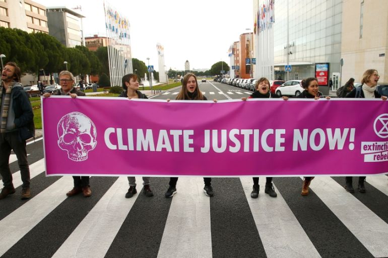 Activists protest against climate change as the COP25 climate summit is held in Madrid