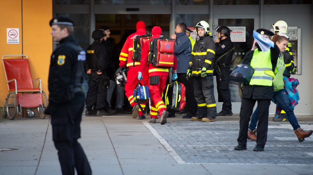 Rescuers enter a hospital after a shooting incident, in Ostrava, Czech Republic, 10 December 2019. According to police, at least six people have been killed in a shooting at a hospital in Ostrava. The