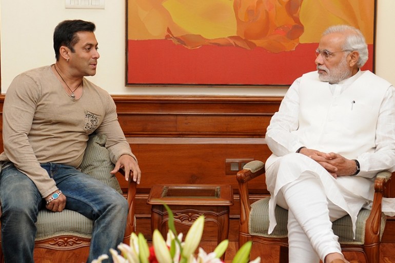 In this handout photograph released on November 7, 2014, Indian Prime Minister Narendra Modi (R) speaks with Bollywood actor Salman Khan during a meeting in New Delhi on November 6, 2014. [Handout/AFP