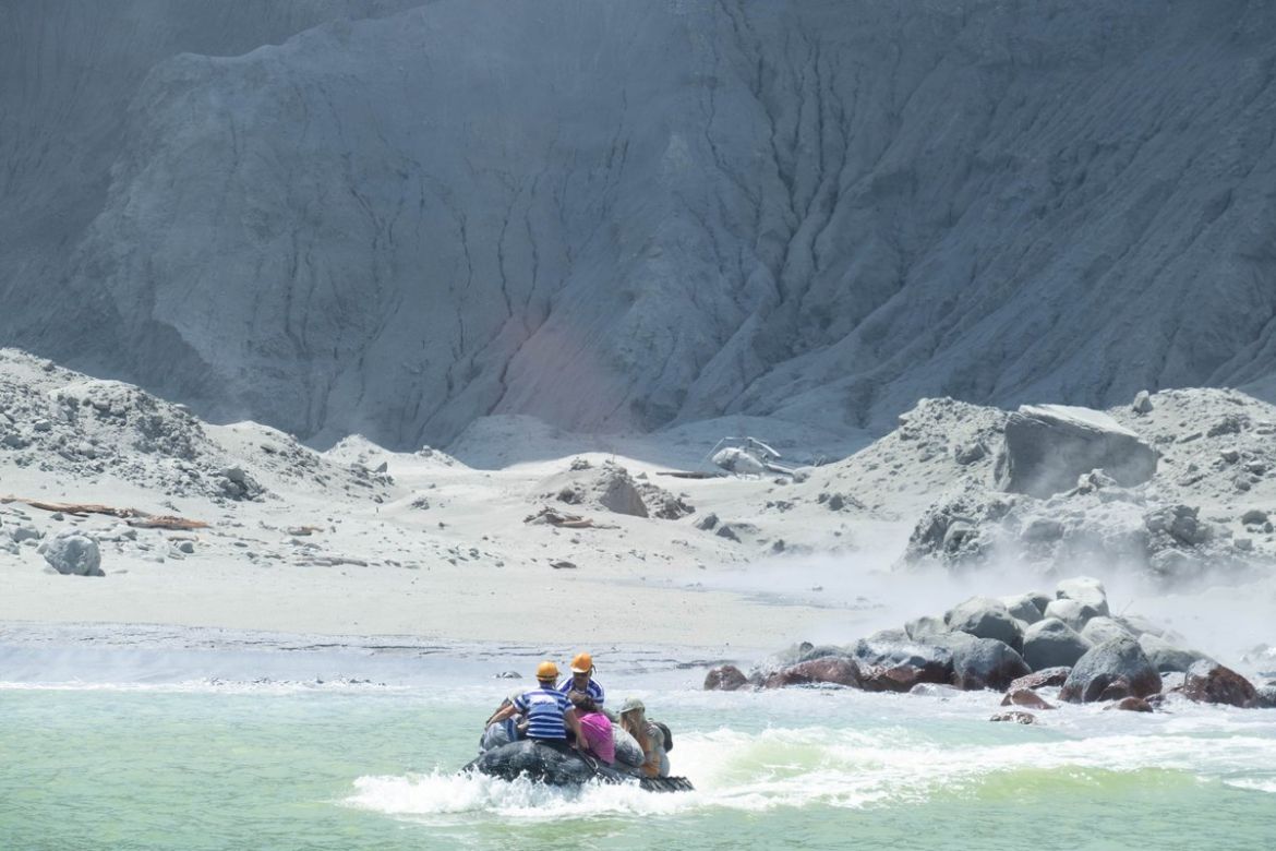 Tour guides evacuate tourists on a boat shortly after the volcano eruption on White Island, New Zealand December 9, 2019 in this picture obtained from social media. @SCH/via REUTERS THIS IMAGE HAS BEE