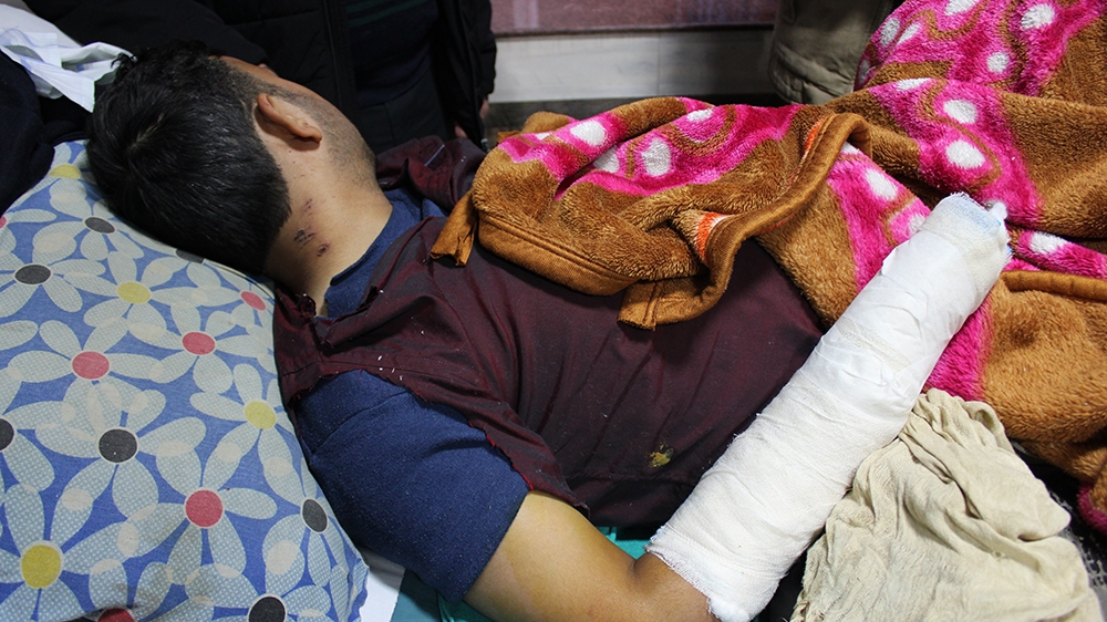 Mohammad Tariq pictured on the hpspital bed  [Bilal Kuchay/Al Jazeera]