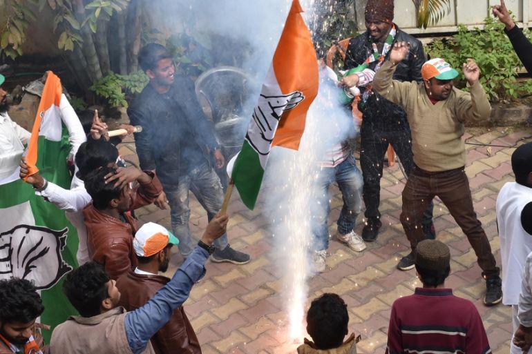 Congress-JMM alliance workers celebrate results projecting an assembly majority in the Jharkhand state election in Ranchi on December 23, 2019. Rajesh Kumar / AFP