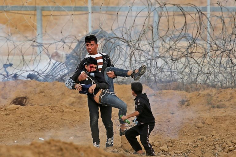 Wounded Palestinian boy is evacuated during an anti-Israel protest in the southern Gaza Strip