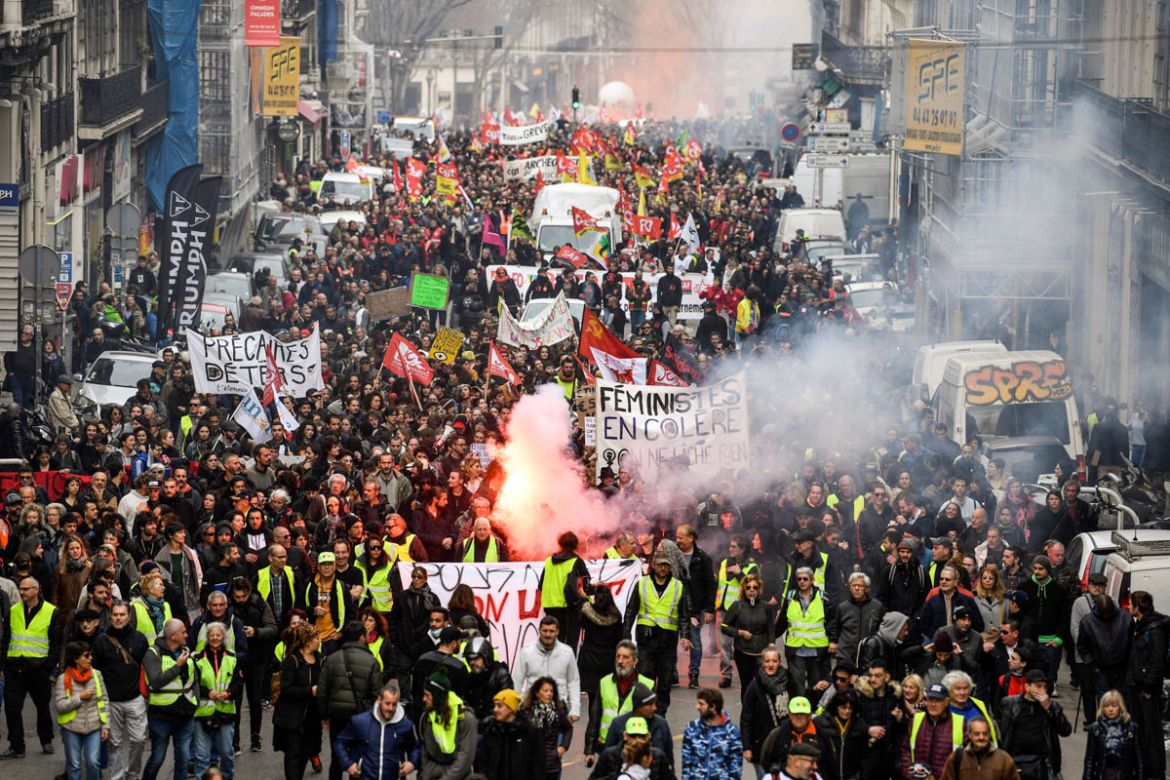 People march on December 17, 2019 in Marseille during a demonstration as part of a third countrywide day of protests over a government pensions overhaul, with the government showing no signs it will g