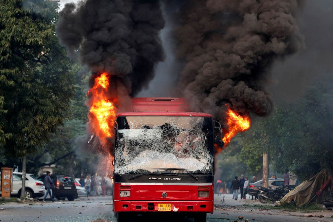 A burning bus is seen after it was set on fire by demonstrators during a protest against a new citizenship law, in New Delhi, India, December 15, 2019. REUTERS/Adnan Abidi