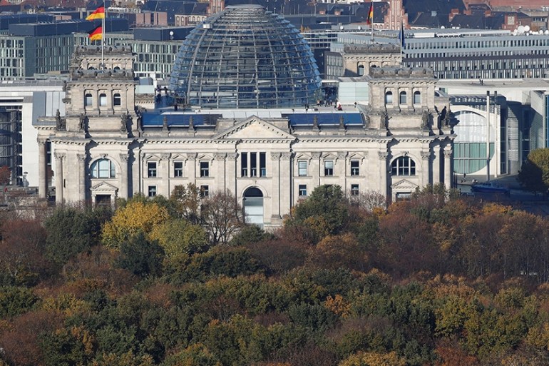 The Reichstag building, the seat of the German lower house of parliament Bundestag is pictured at the Tiergarten park with autumnal trees in Berlin, Germany, November 6, 2018
