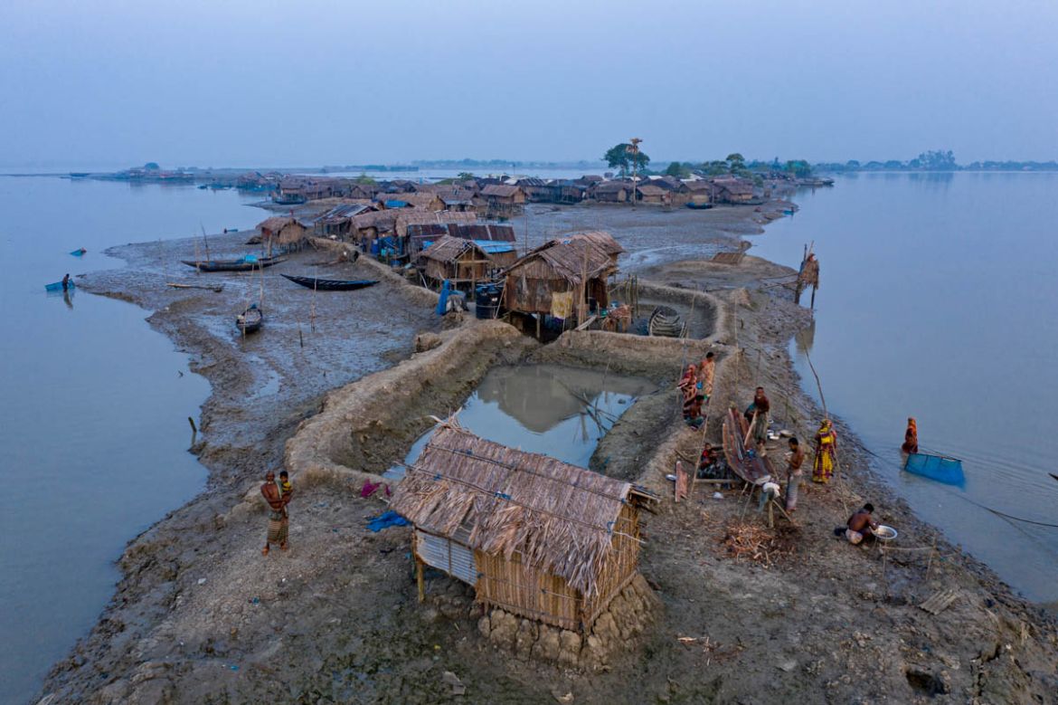 Coastal people who losses their house several times living on temporary houses near Shibsha river near Sundarban in Bangladesh. Bangladesh is projected to lose around 2,270 hectares of land this year