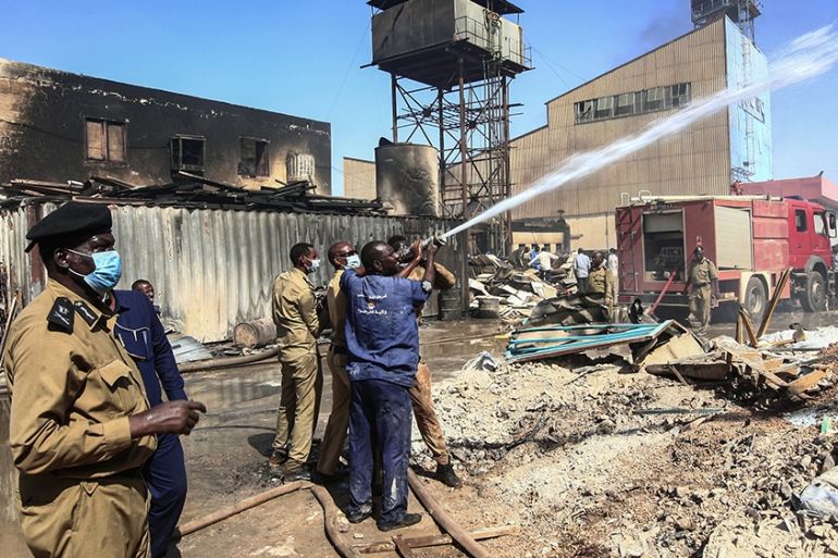 Members of the Sudanese Civil Defence put out a fire at a tile manufacturing unit in an industrial zone in north Khartoum, on December 3, 2019. - A doctors committee linked to the country''s protest mo
