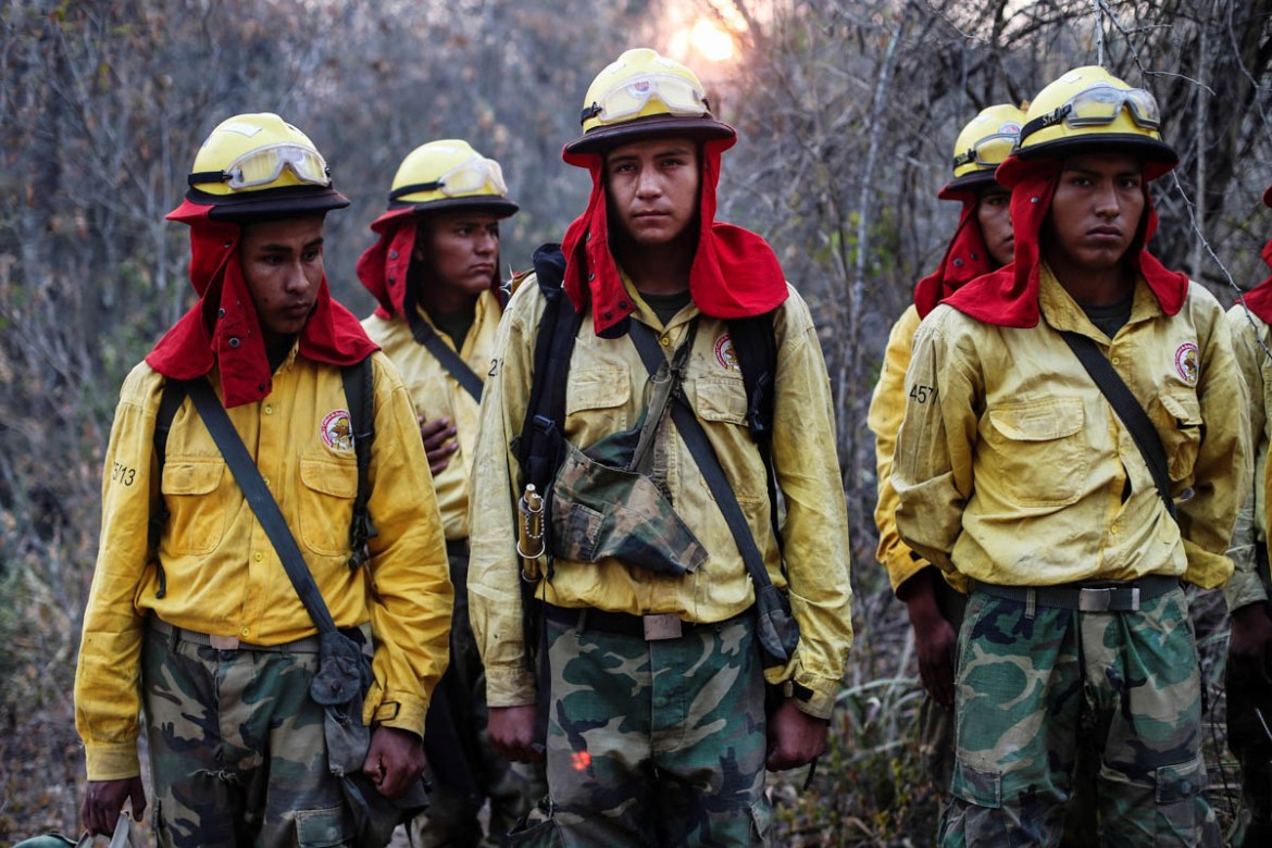 Firefighters from Bolivia''s army line up before patrolling an area where wildfires have destroyed hectares of forest at Rancho Grande village in Robore, Bolivia, September 24, 2019. REUTERS/Edgard Gar