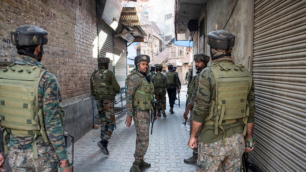 Indian paramilitary soldiers patrol during a search operation after an explosion in Srinagar, Indian controlled Kashmir, Saturday, Oct. 12, 2019. At least seven pedestrians were wounded on Saturday in