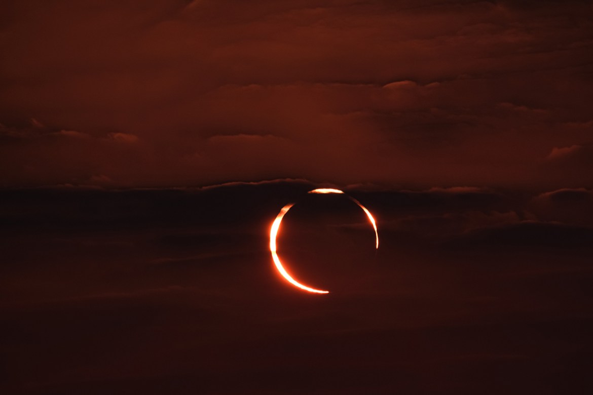 The moon passes between the sun and the earth during an annular solar eclipse in Doha, Qatar [Sorin Furcoi/Al Jazeera]