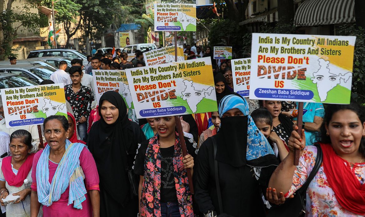 Indian Muslim women hold placards during a silent protest, organized by the Congress party, against the Citizenship Amendment Bill (CAB) in Mumbai, India, 11 December 2019. The passing of the bill wil