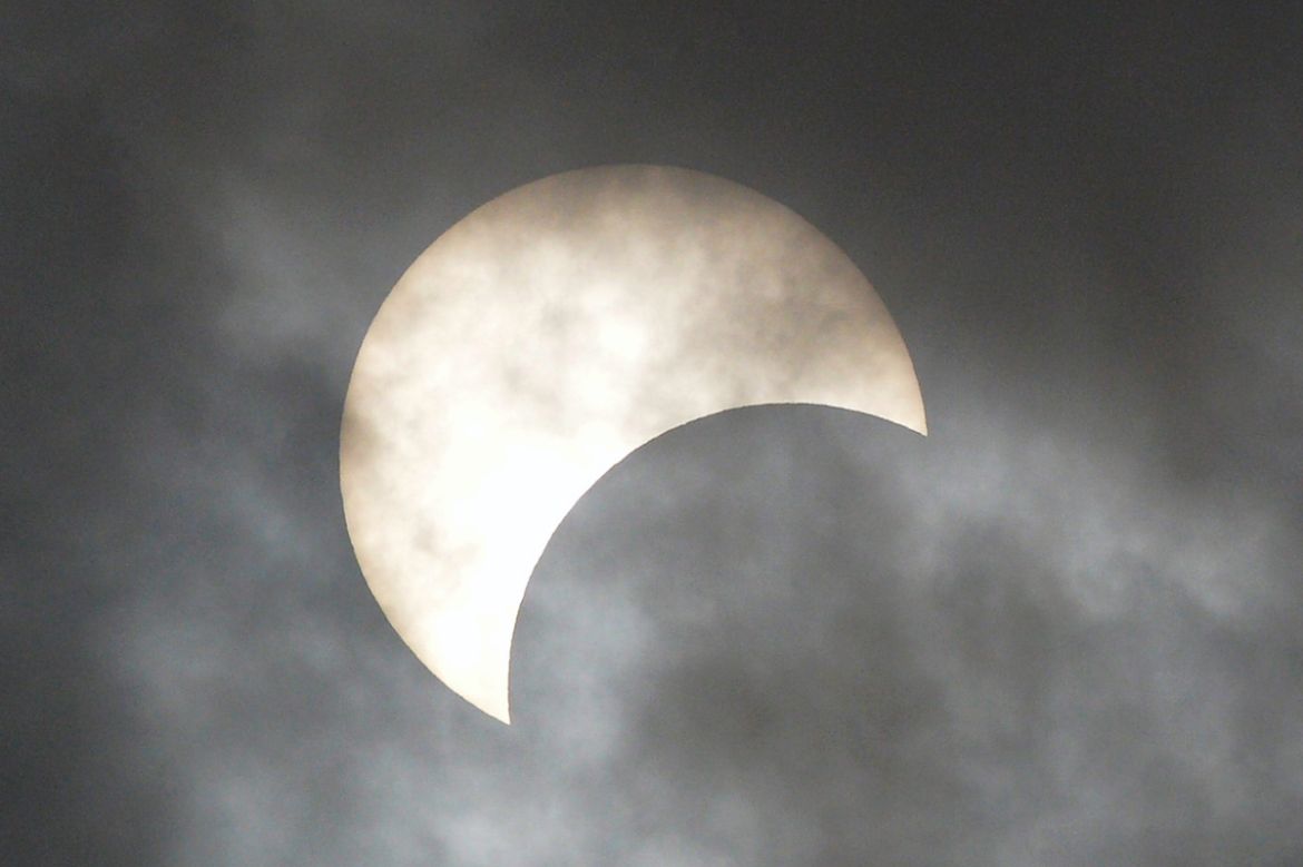 The moon covers the sun in a rare "ring of fire" solar eclipse as seen from Dhaka on December 26, 2019. (Photo by Munir UZ ZAMAN / AFP)