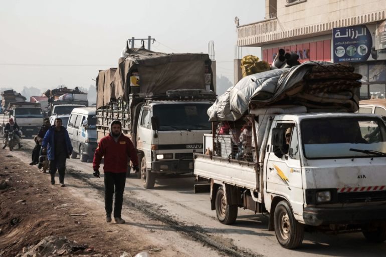 This picture taken on December 22, 2019 shows a column of traffic composed of the vehicles of people from the south of Idlib province fleeing bombardment by the government and its allies on the northw