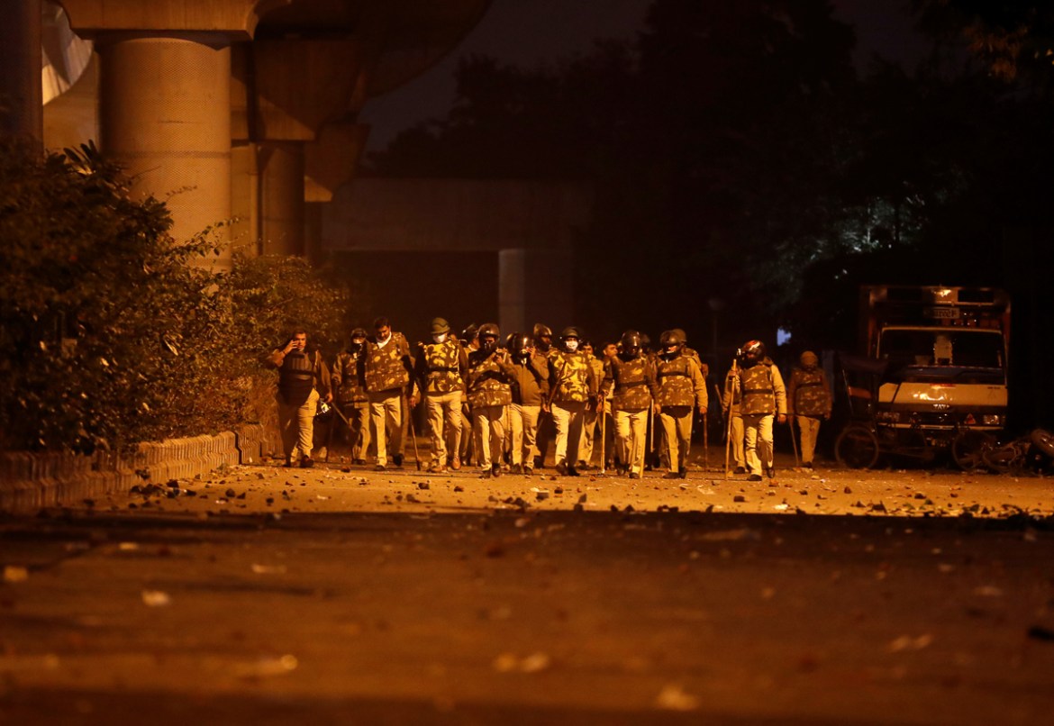 Policemen patrol outside the Jamia Milia University following a protest against a new citizenship law, in New Delhi, India, December 15, 2019. REUTERS/Adnan Abidi