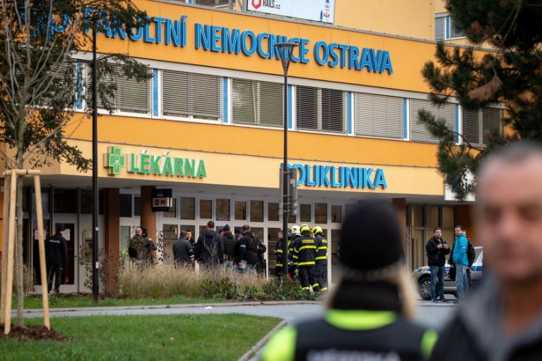Police officers stand guard near the site of a shooting in front of a hospital in Ostrava, Czech Republic, December 10, 2019. REUTERS/Lukas Kabon