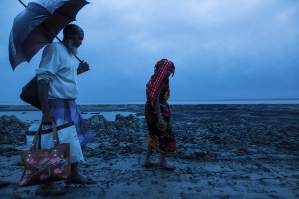 A family going to cyclone shelter home before cyclone Fani attack in coastal area near Sundarban. Cyclone Fani hits in Bangladesh and India where Bangladesh damaged around USD $63 million.