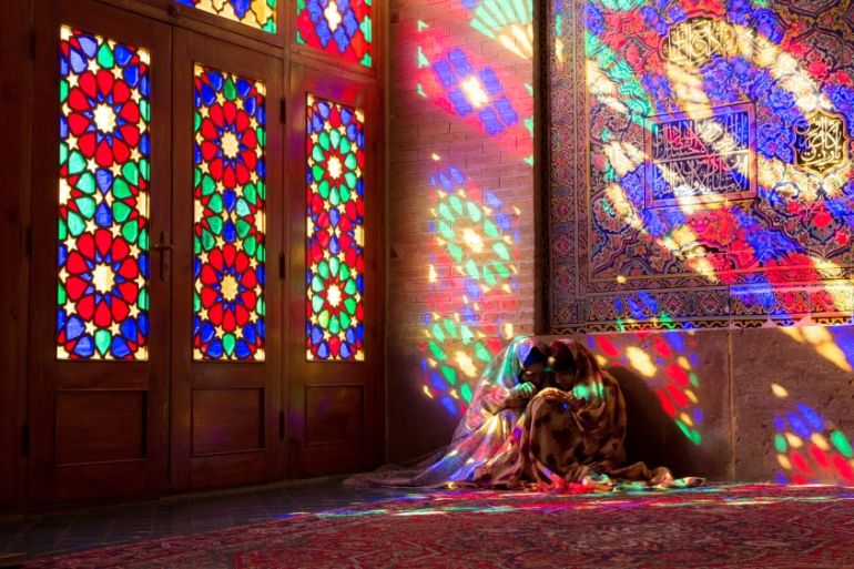 Iranian young women sit on a floor of Nasir al-Mulk Mosque, called the Pink Mosque as well, in Shiraz, Iran, September 15, 2018. (Photo by Dominika Zarzycka/NurPhoto via Getty Images)