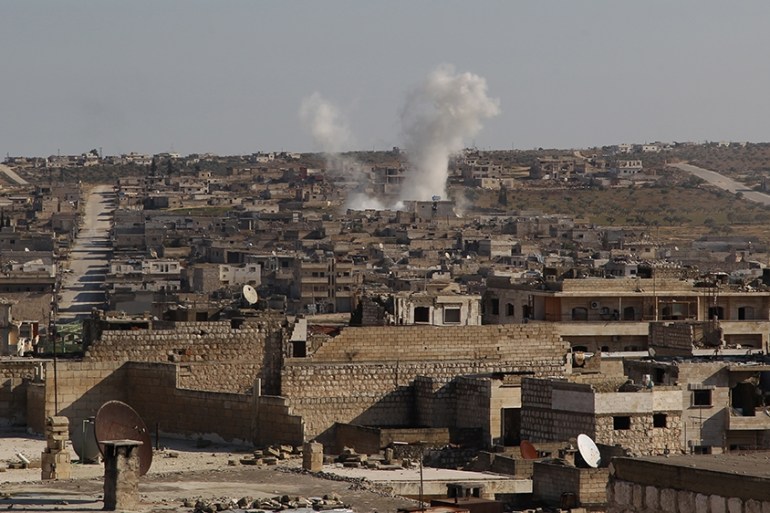 Smoke billows following a reported air strike by pro-regime forces in the town of Maaret Al-Numan in Syria''s northwestern Idlib province on January 13, 2020. (Photo by Abdulaziz KETAZ / AFP)