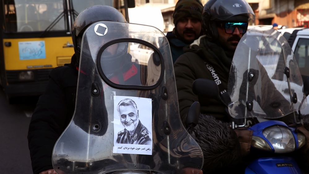 A picture of Iranian Major-General Qassem Soleimani, head of the elite Quds Force, who was killed in an air strike at Baghdad airport, is seen on a motorcycle in Tehran