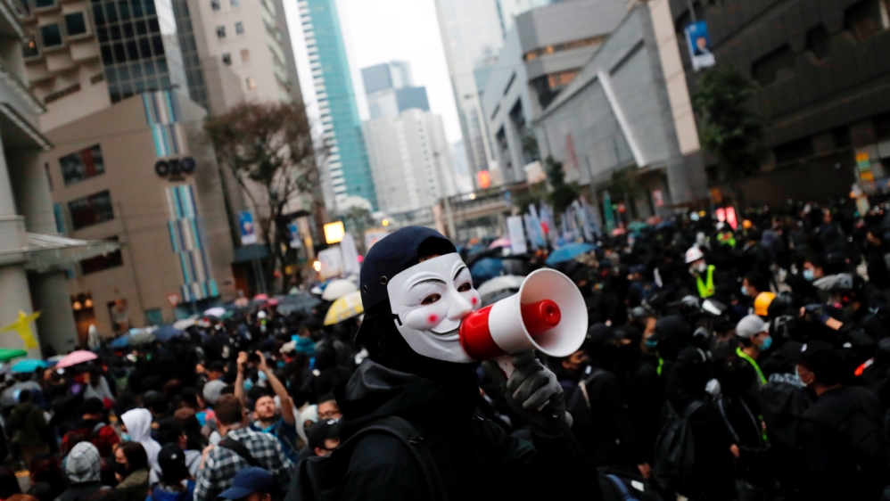Anti-government protesters march during a demonstration on the New Year’s Day to call for better governance and democratic reforms in Hong Kong