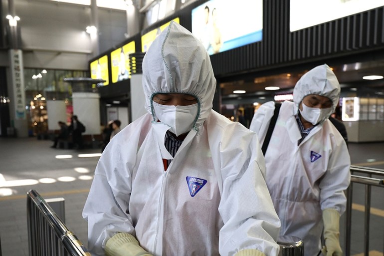 Disinfection workers wearing protective gears spray anti-septic solution in an train terminal amid rising public concerns over the spread of China''s Wuhan Coronavirus at SRT train station on January 2