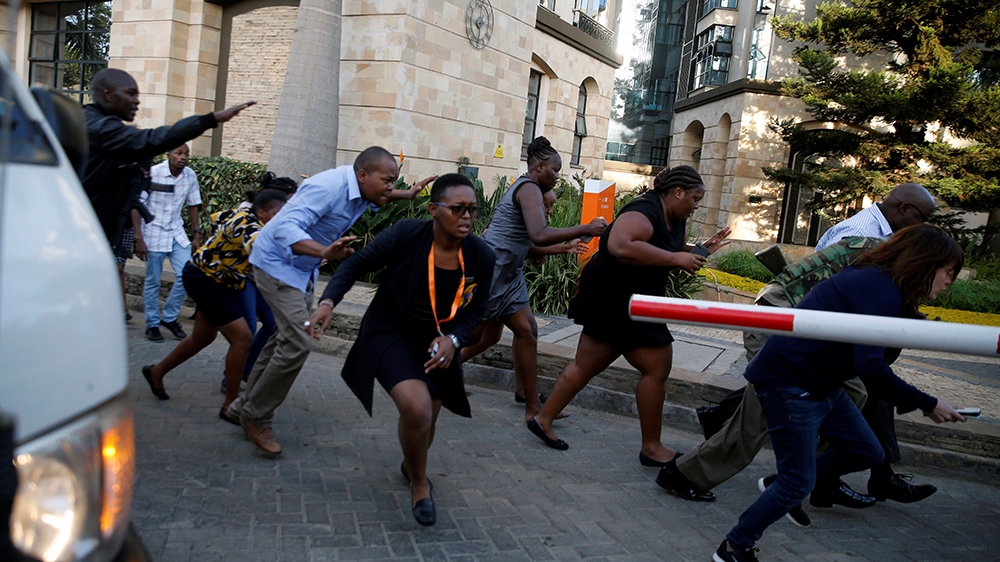 People run as they are evacuated at the scene where explosions and gunshots were heard at the Dusit hotel compound, in Nairobi, Kenya January 15, 2019. REUTERS/Thomas Mukoya
