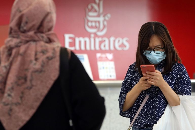A traveller wears a mask at the Dubai International Airport, after the UAE''s Ministry of Health and Community Prevention confirmed the country''s first case of coronavirus, in Dubai, United Arab Emirat