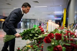 Ukrainian President Volodymyr Zelenskiy lays flowers