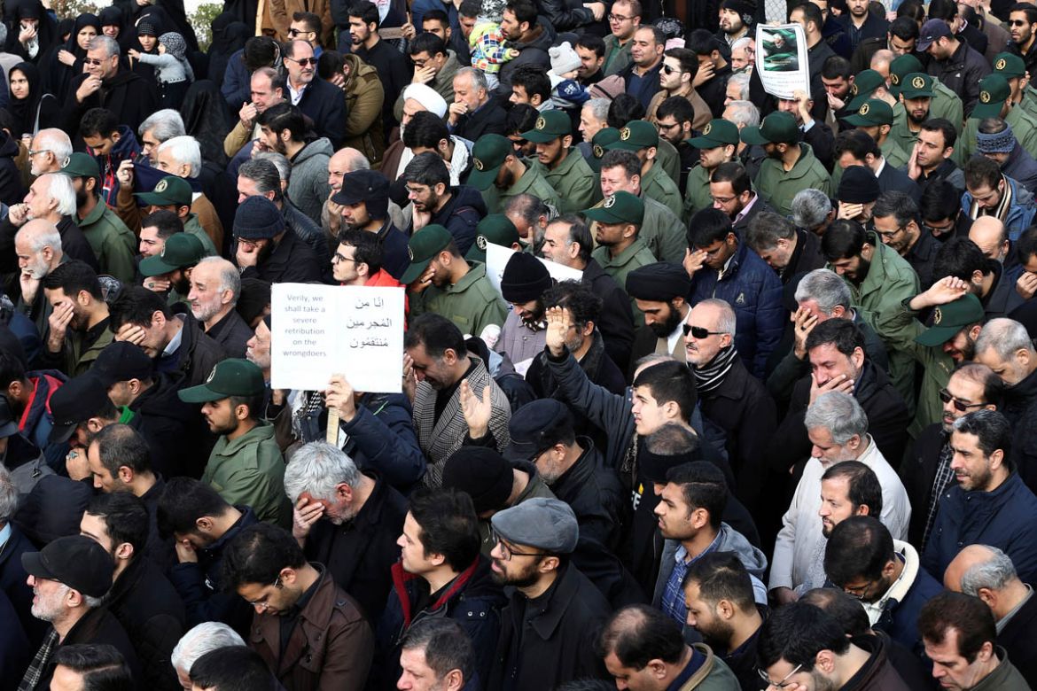Demonstrators react during a protest against the assassination of the Iranian Major-General Qassem Soleimani, head of the elite Quds Force, and Iraqi militia commander Abu Mahdi al-Muhandis who were k