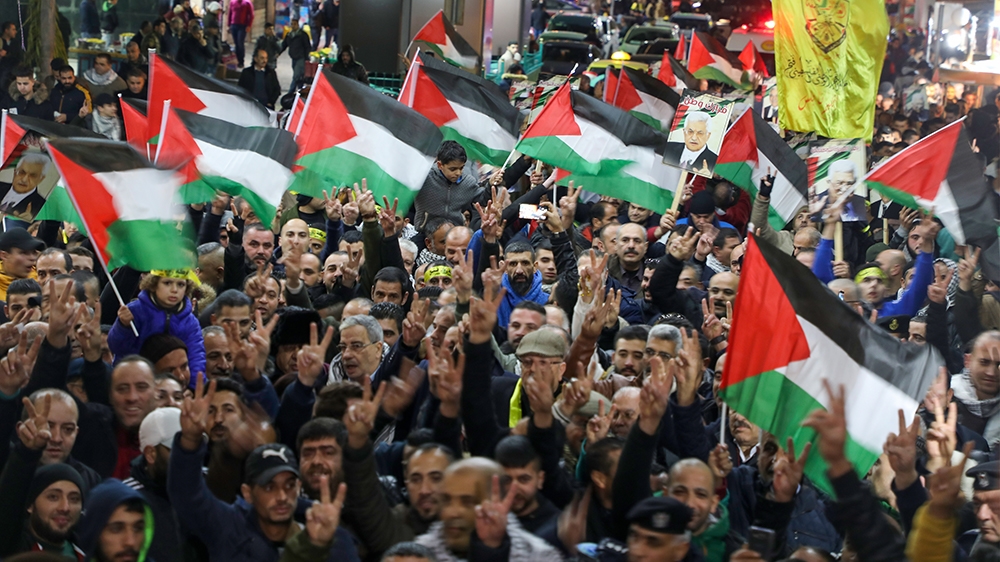 Palestinians take part in a demonstration in the West Bank city of Nablus on January 28, 2020, to protest against US President Donald Trump's peace plan proposal. - Palestinians staged protests agains