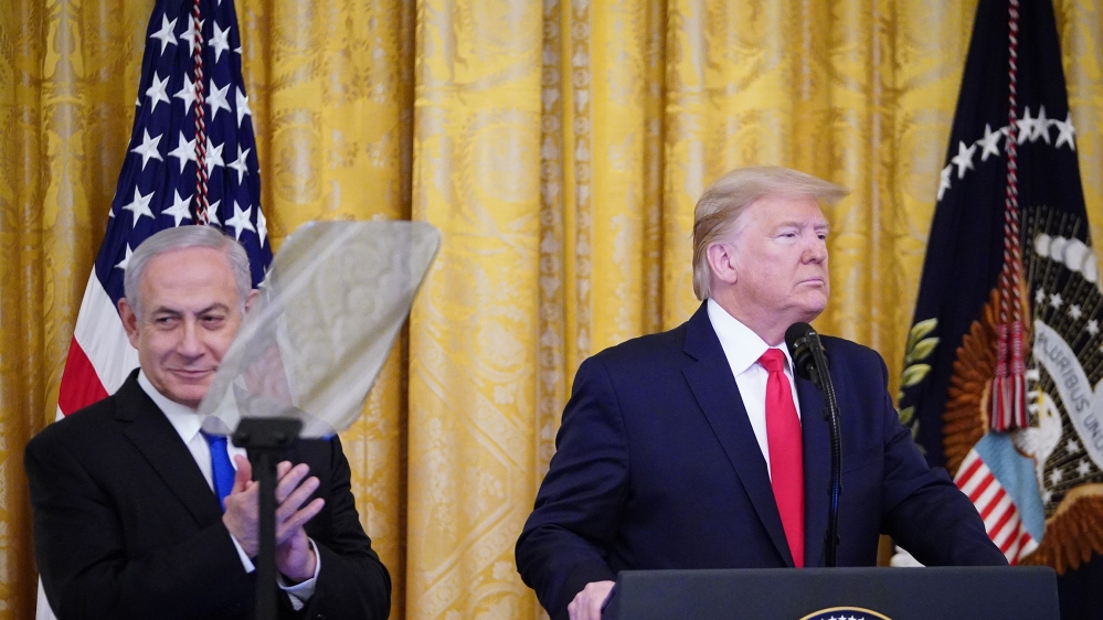 US President Donald Trump and Israel's Prime Minister Benjamin Netanyahu take part in an announcement of Trump's Middle East peace plan in the East Room of the White House in Washington, DC on January