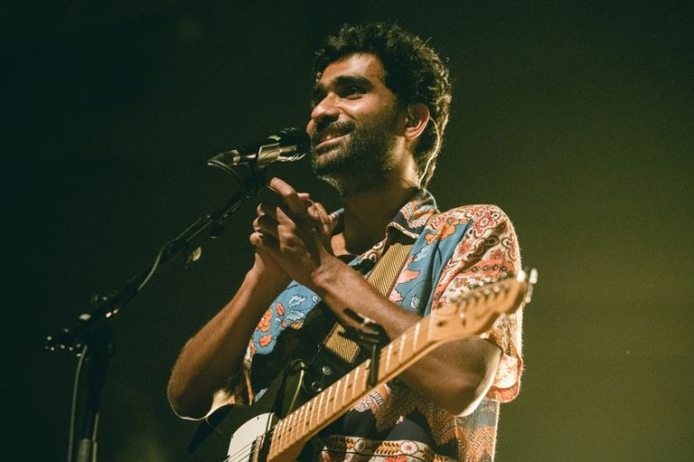 INDIA-MUSIC-CELEBRITY-KUHAD-OBAMA In this handout photograph taken in December 2019 and released on January 3, 2020, singer Prateek Kuhad reacts as he performs on stage in New Delhi. Starting out, In