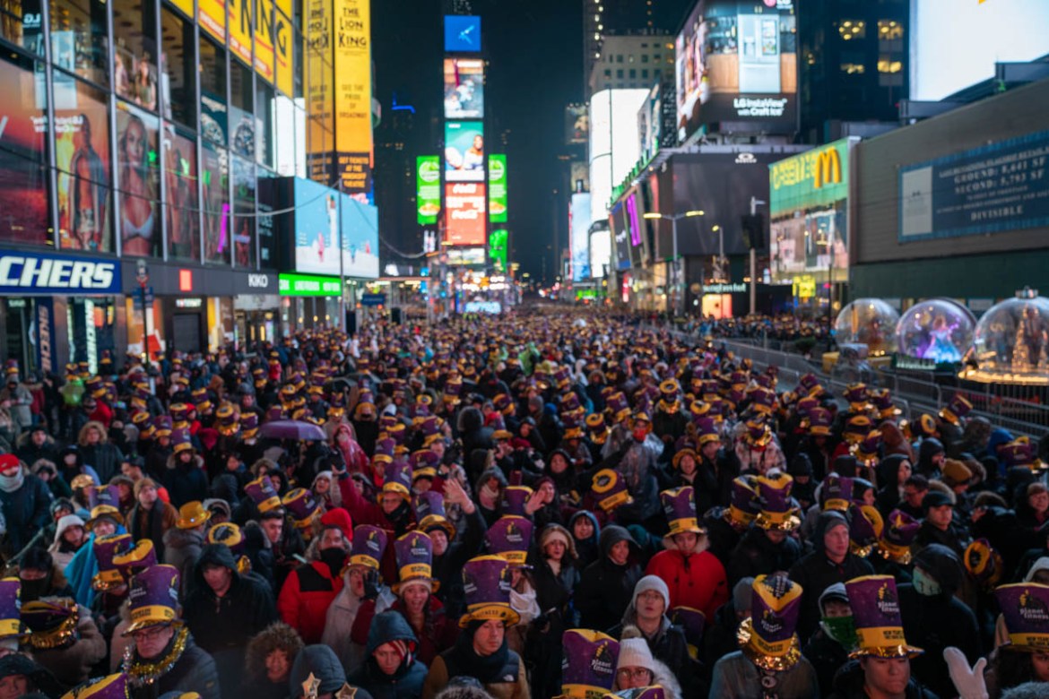 NEW YORK, NY - DECEMBER 31: Revelers at Times Square during the New Year''s Eve celebration on December 31, 2019 in New York City. People began celebrating New Year''s Eve at Times Square in 1904, in 19