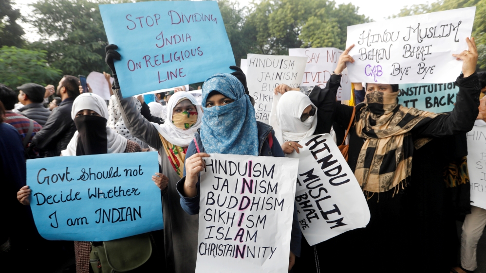 Protesters hold placards during a protest against the Citizenship Amendment Bill in New Delhi