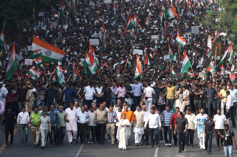 Mamata Banerjee, the Chief Minister of West Bengal, and her party supporters attend a protest march against the National Register of Citizens (NRC) and a new citizenship law, in Kolkata, India, Decemb