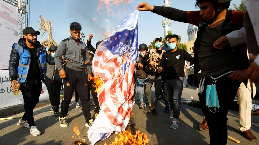 Supporters of Qais al-Khazali, leader of the Asaib Ahl al-Haq Iran-backed militia group, burnt an U.S. flag during a demonstration against U.S sanctions targeting al-Khazali, in Baghdad