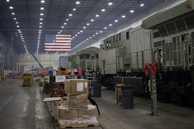 An American flag hangs above an assembly line in Fort Worth, Texas, USA