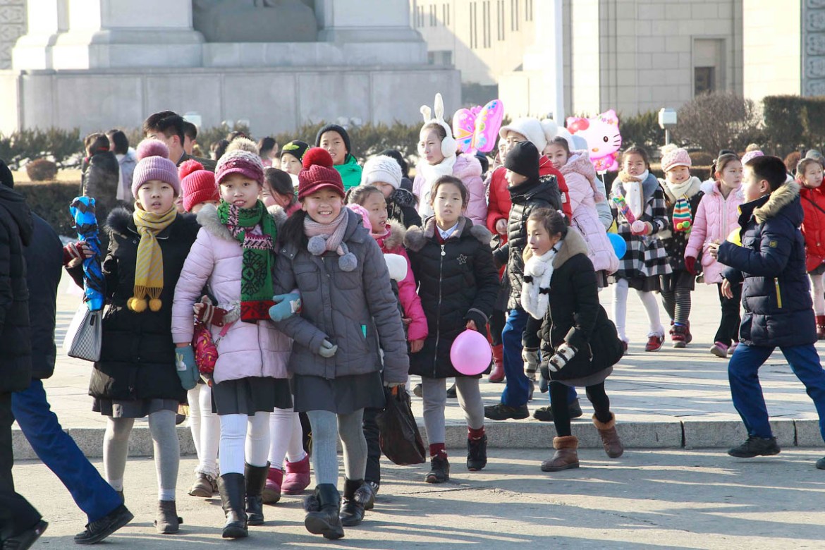 Students head to play folk games at the square of Arch of Triumph in Pyongyang, North Korea Wednesday, Jan. 1, 2020. (AP photo/Jon Chol Jin)