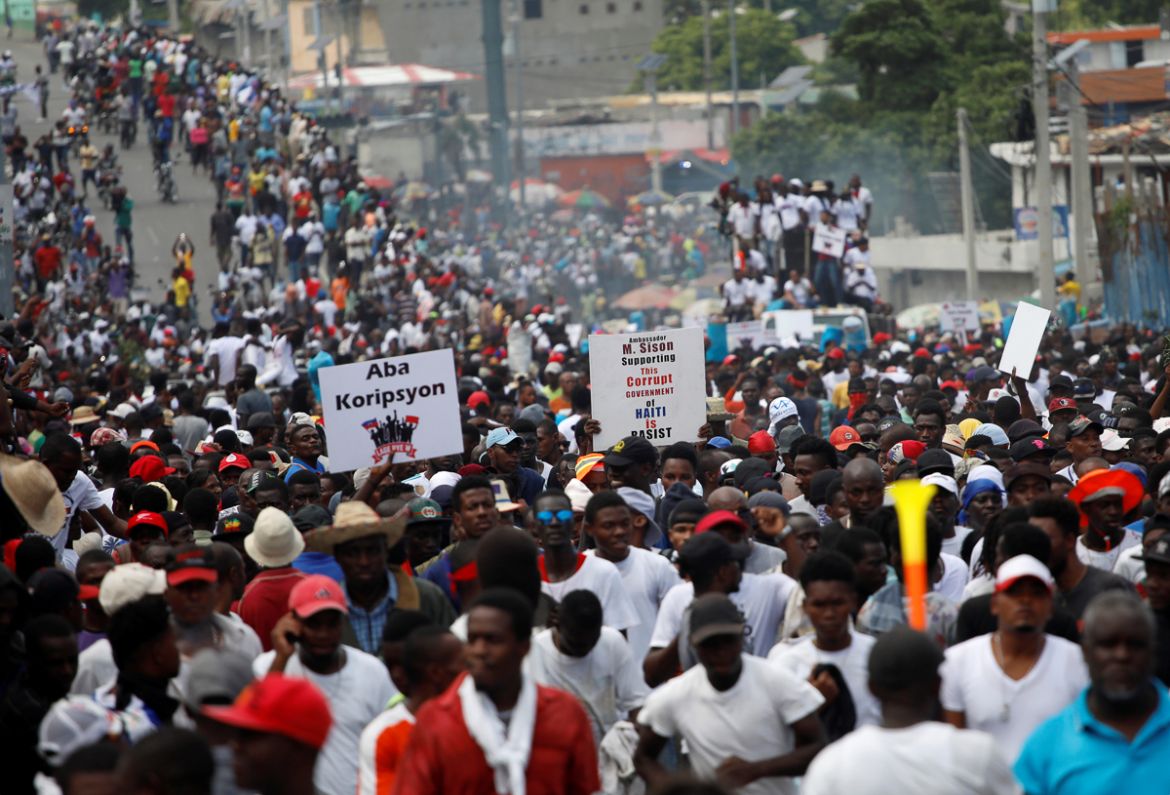 Protesters march during a demonstration to demand the resignation of Haitian President Jovenel Moise, in the streets of Port-au-Prince, Haiti October 20, 2019. REUTERS/Andres Martinez Casares