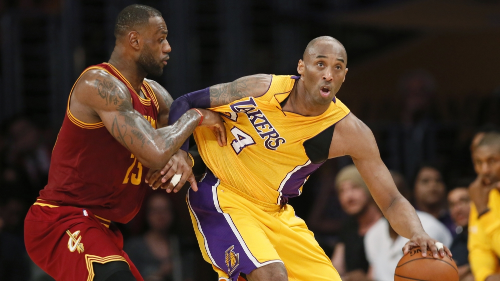 Cleveland Cavaliers' LeBron James, left, defends Los Angeles Lakers' Kobe Bryant during the first half of an NBA basketball game, Thursday, March 10, 2016, in Los Angeles. (AP Photo/Danny Moloshok)