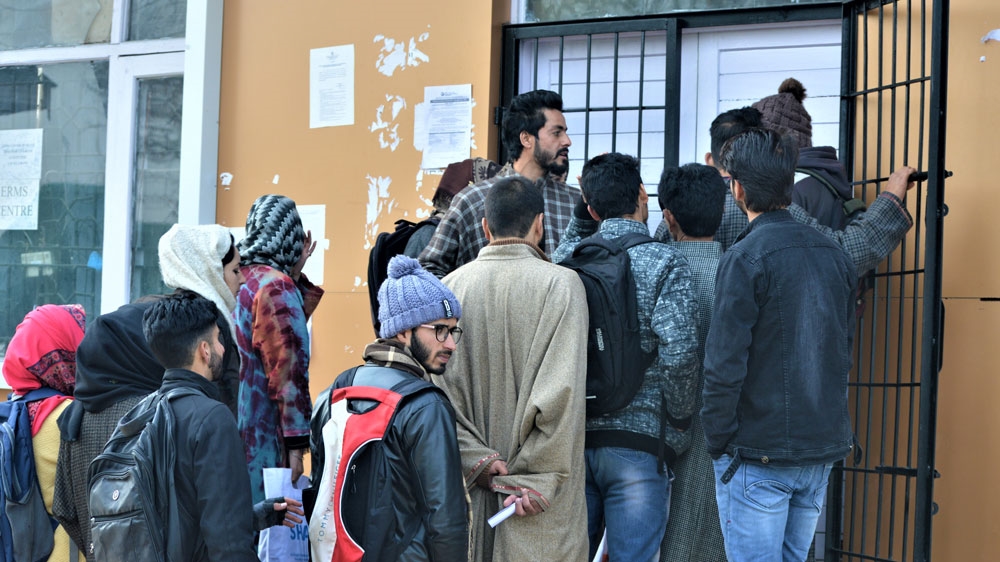 People queue up to go online at a government set-up internet cafe in Budgam, Kashmir