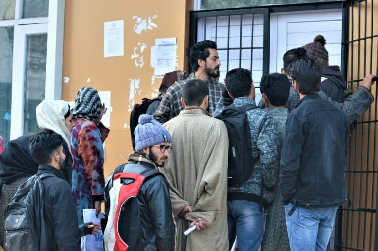 People queue up to go online at a government set-up internet cafe in Budgam, Kashmir