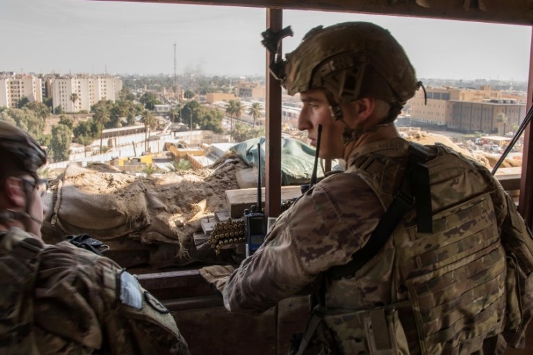 U.S. Army soldiers keep watch on the U.S. embassy compound in Baghdad