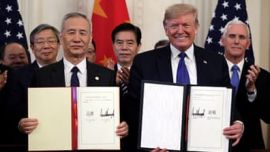 President Donald Trump and Chinese Vice Premier Liu He sign “phase one” of a US China trade agreement, in the East Room of the White House, Wednesday, Jan. 15, 2019, in Washington. (AP Photo/ Evan Vuc