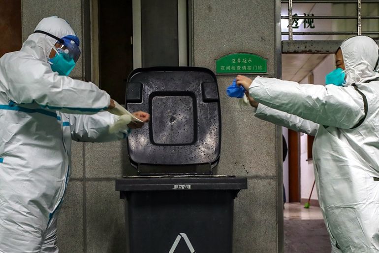 The ambulance staff dispose of an outfit at the hospital in Wuhan, Hubei province, China, 26 January 2020 (issued 27 January 2020). According to media reports, Wuhan is widely considered as the origin