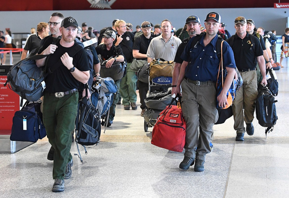 A contingent of 39 firefighters from the United states and Canada arrive at Melbourne Airport in Melbourne, Thursday, January 2, 2020. The firefighters will assist local crews with ongoing fires burni